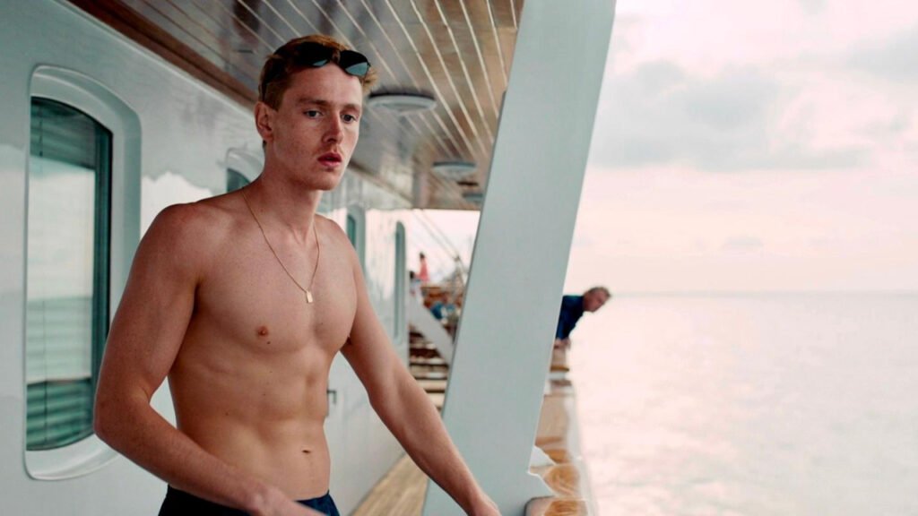 Harris Dickinson in a scene from the 2022 satirical film Triangle of Sadness