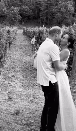 Prince Harry and Meghan Markle sharing a kiss