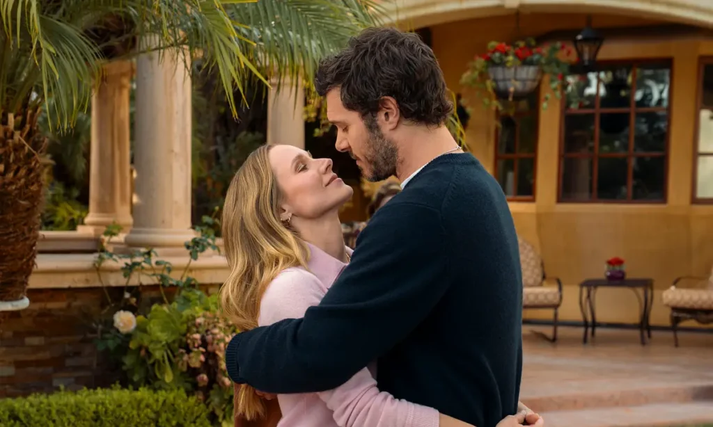 Kristen Bell as Joanne and Adam Brody as Noah embracing and looking at each other affectionately outdoors in a scene from Nobody Wants This Season 3.