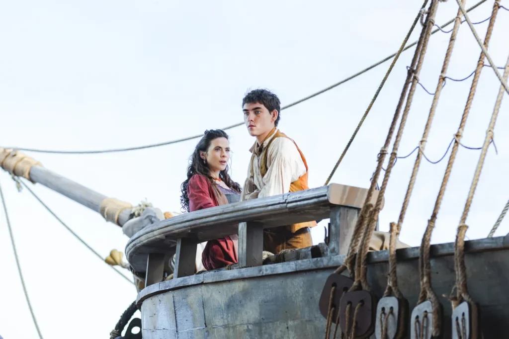 Hayley Atwell as Bess Hawkins and Tom Sweet as Jim Hawkins in Treasure Island.