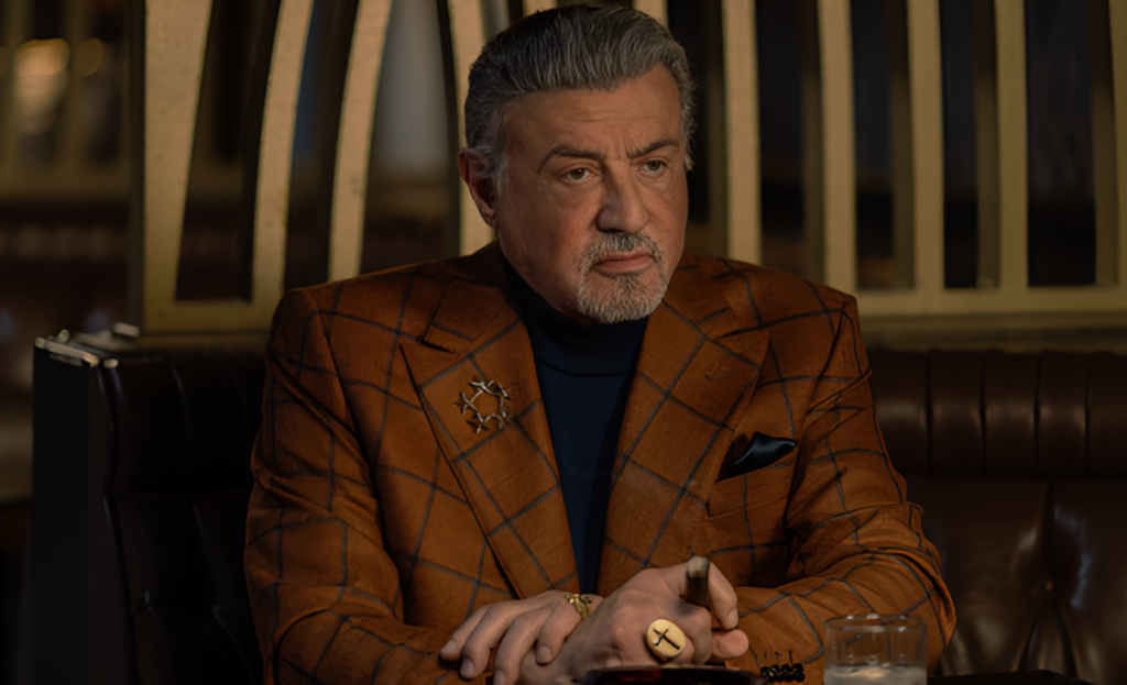 Sylvester Stallone as Dwight Manfredi wearing a stylish patterned jacket in Tulsa King Season 4